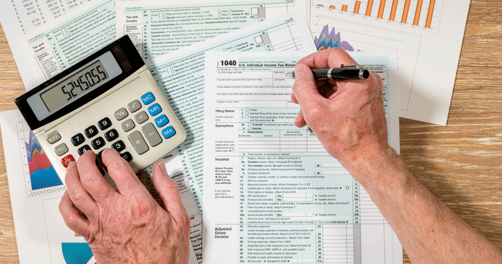 Person Filling out Tax Form