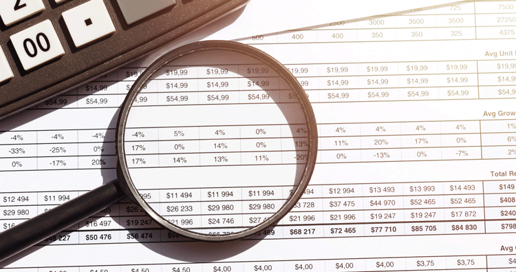 Magnifying glass on financial report